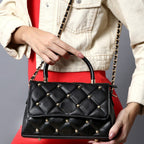 QUILTED STUDDED BLACK LUXE TOP HANDLE HANDBAG
